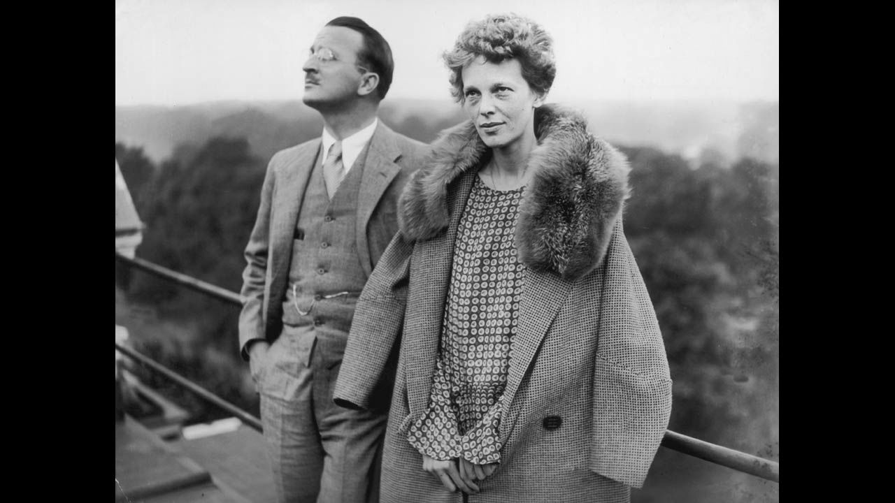 Earhart stands on the roof of the Hyde Park Hotel in London with Capt. Hilton H Railey on June 20,1928.