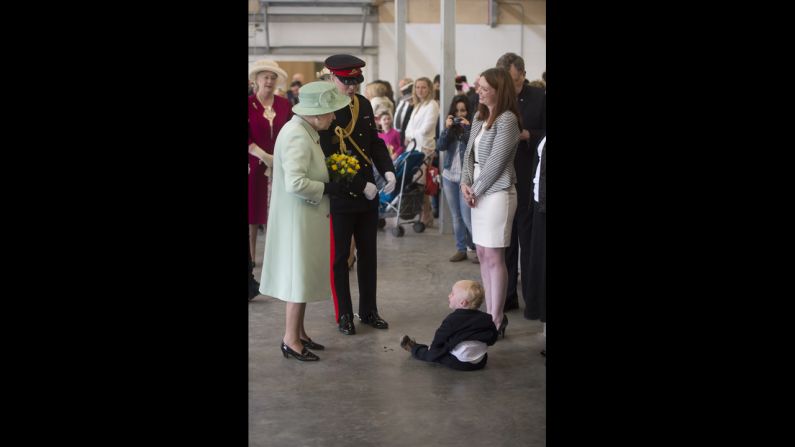 The families of serving personnel greet the queen. 