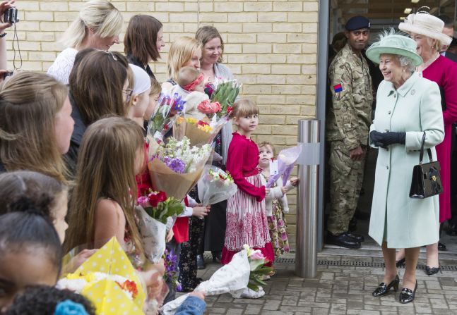 Well-wishers greet the queen. 