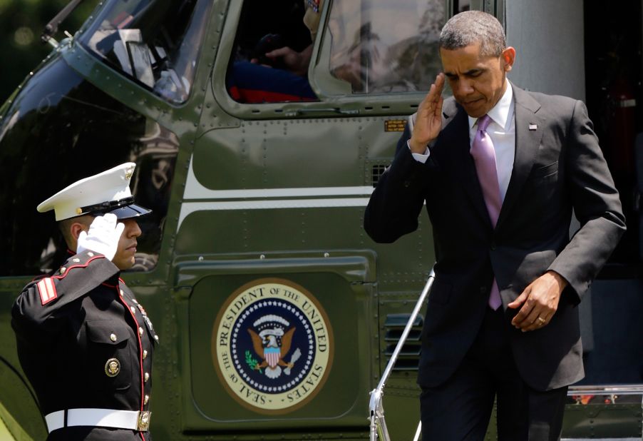 President Barack Obama salutes as he returns to the White House after a trip to Chicago on Thursday, May 30. Federal authorities searched the home of a Texas man on Friday in connection with an investigation into threatening letters, possibly tainted with ricin, that were sent to Obama.