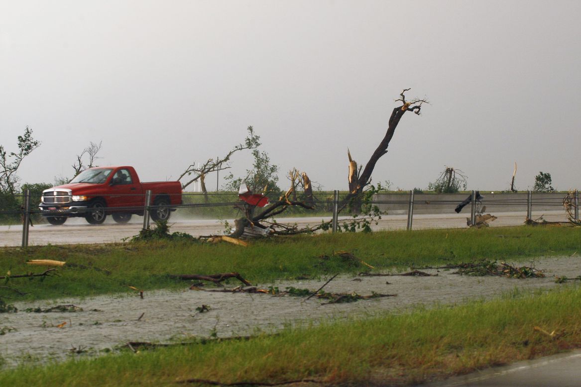 Shredded trees and debris are scattered along Interstate 40 near El Reno, Oklahoma, on May 31. 