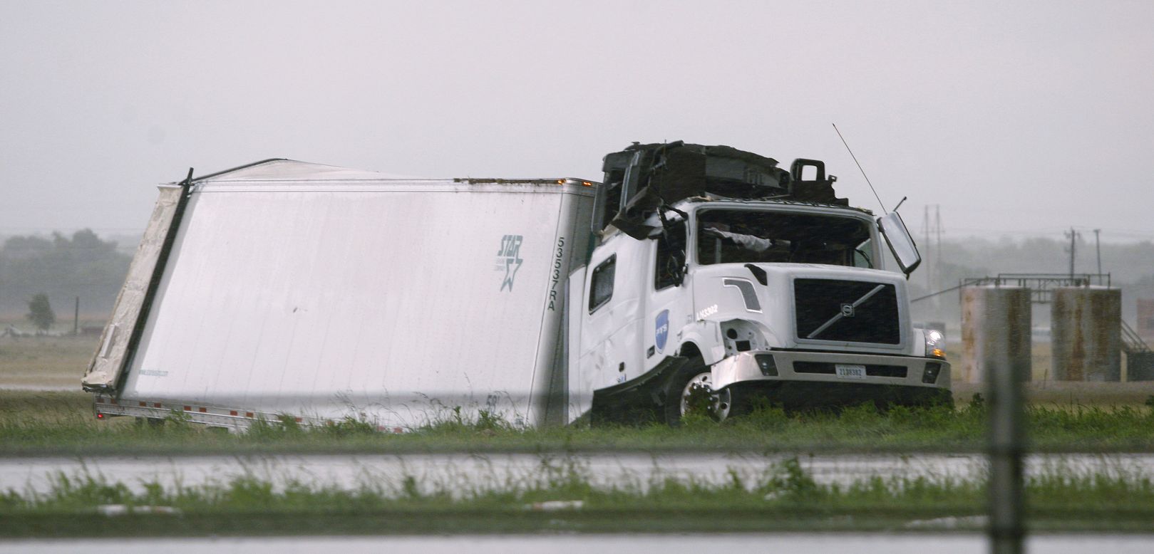 A semi tractor-trailer damaged by a tornado lies along I-40 just east of El Reno on May 31.