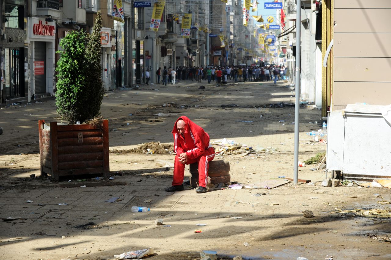 A man catches his breath behind the line where clashes are taking place on June 1.