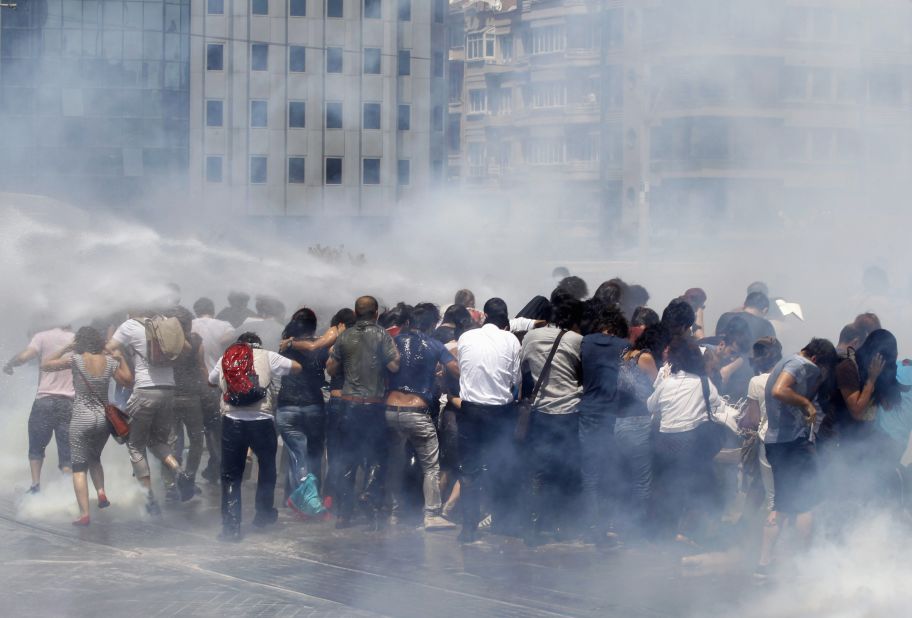 Riot police use tear gas and water cannons to disperse a crowd at Taksim Square on May 31.