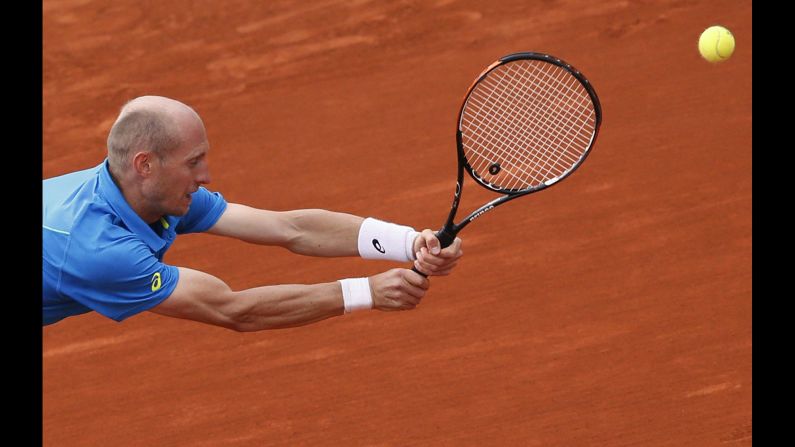 Russia's Nikolay Davydenko reaches to hit a return to France's Richard Gasquet on June 1. Gasquet won 6-4, 6-4, 6-3 .