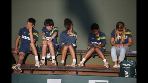 Ball boys and ball girls take a break during the tournament on June 1. 