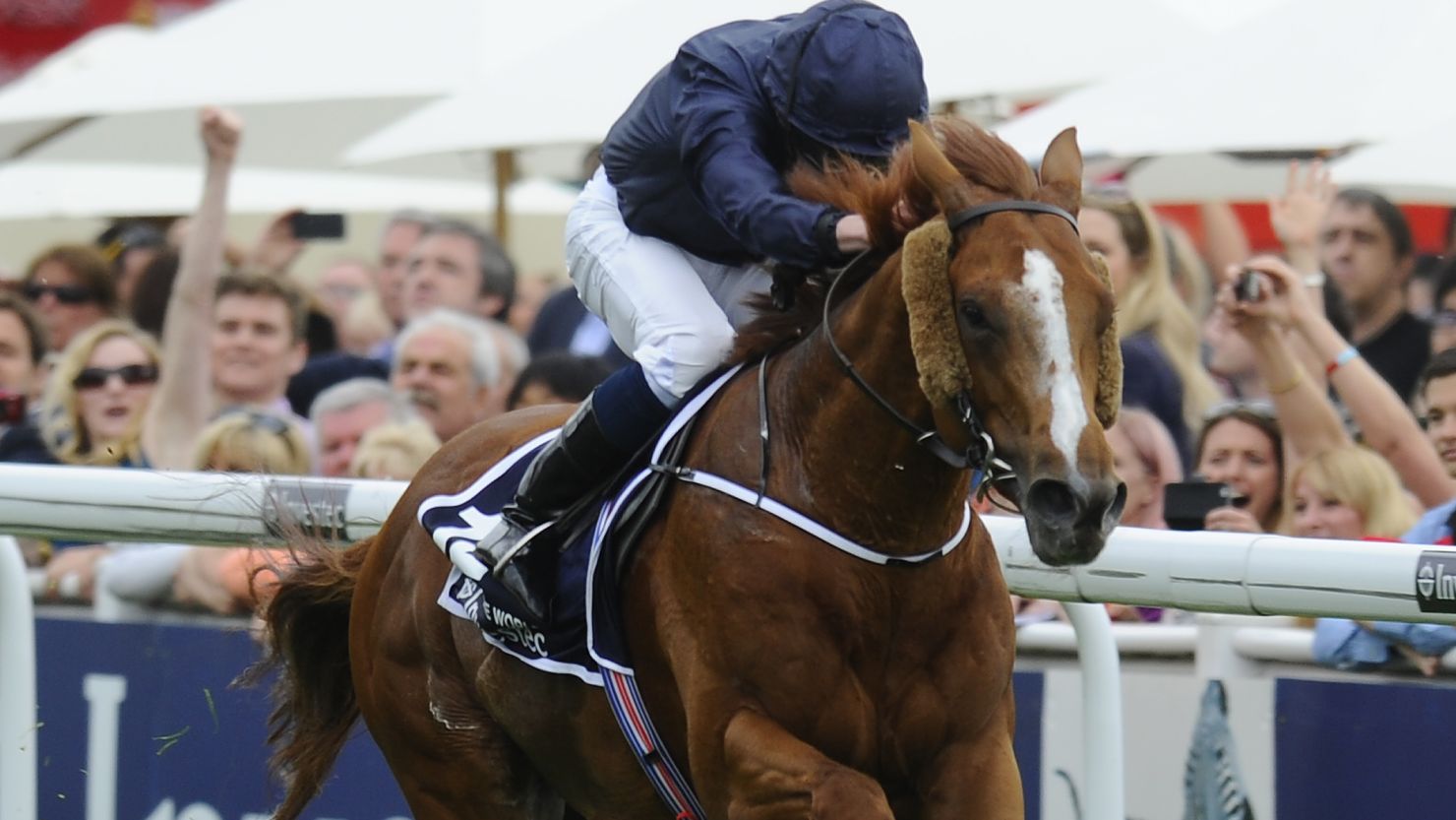 Ryan Moore rides Ruler Of The World to victory at the prestigious Epsom Derby on Saturday.