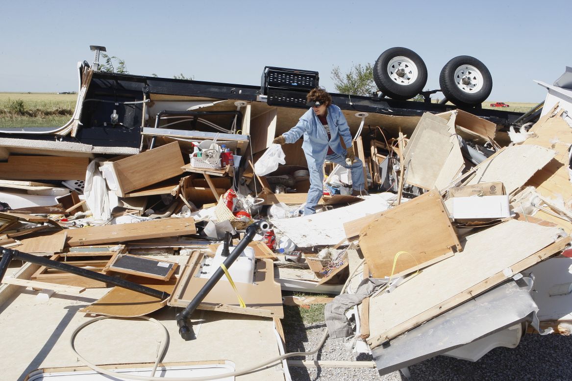 Mikie Hooper collects her belongings from her RV, which was destroyed by a tornado in El Reno, Oklahoma, on June 1.