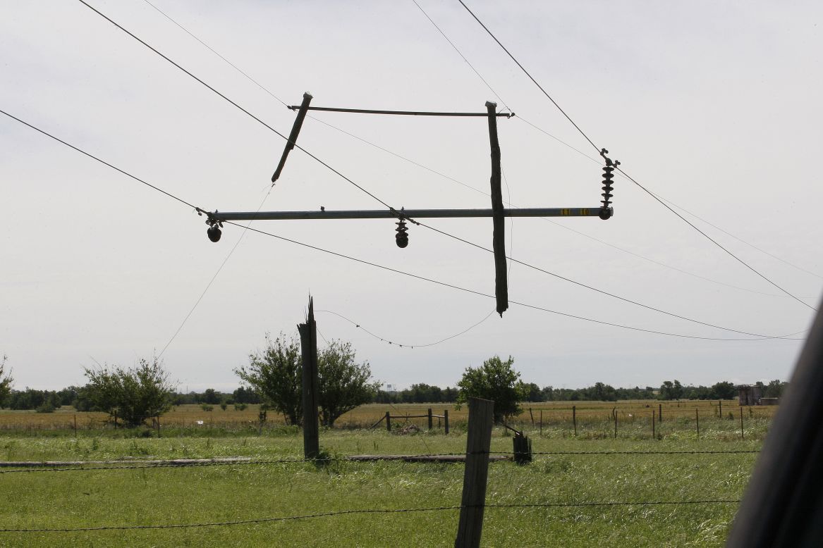 The tornado severed the pole supporting these power lines, leaving the remnants dangling near El Reno on June 1.