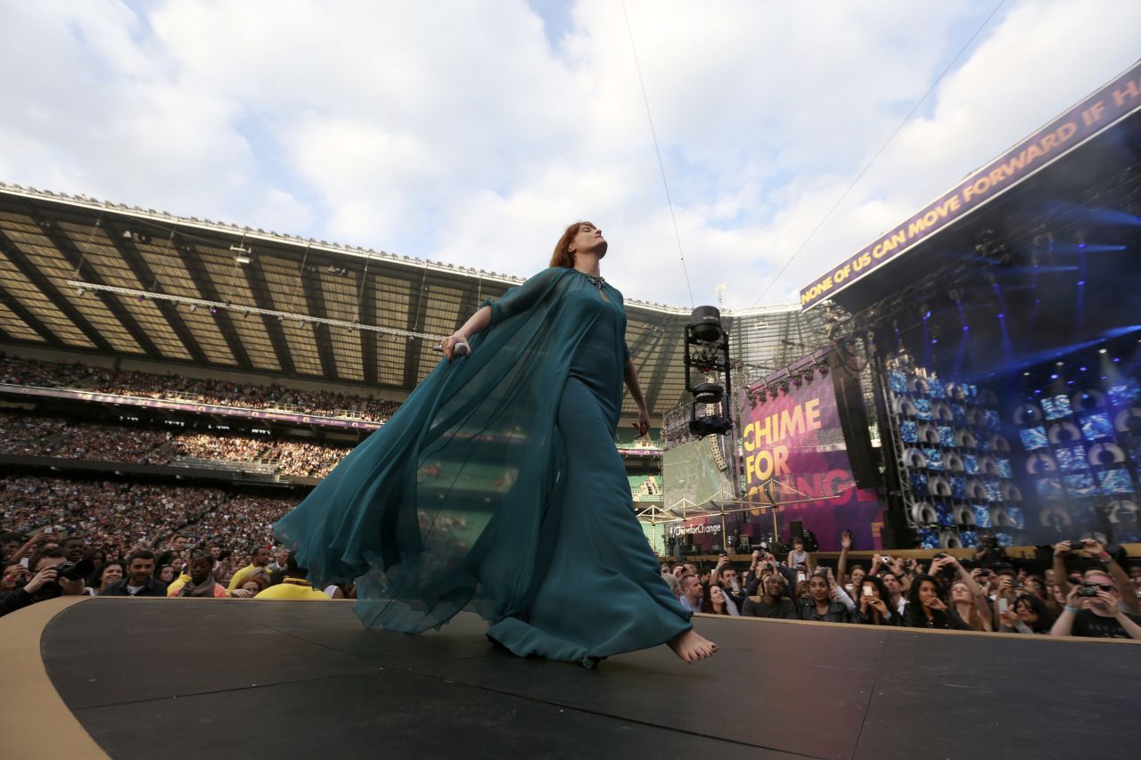 Florence Welch of Florence and the Machine strides across the stage during their performance. 