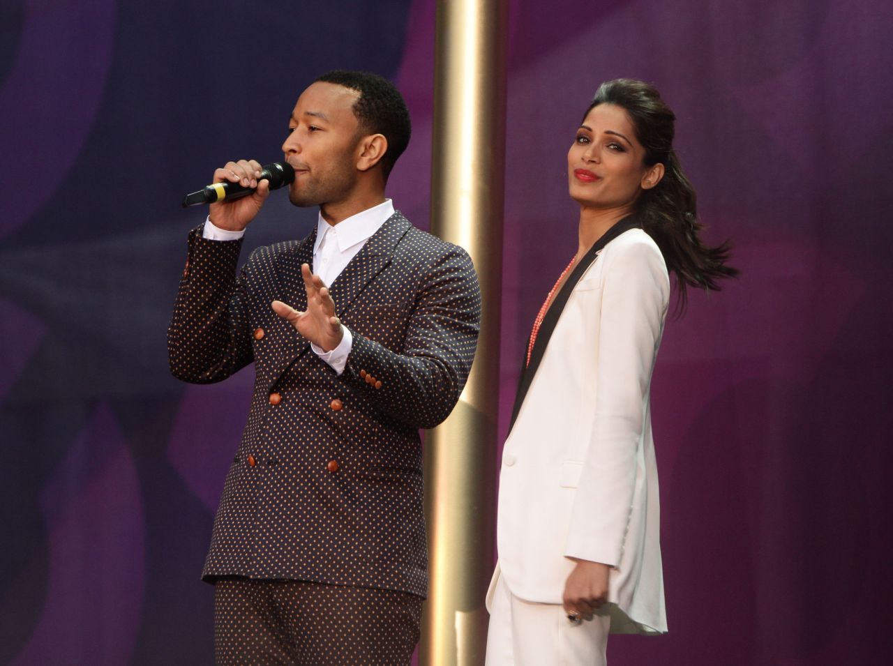 John Legend with Freida Pinto during the event. Pinto said she was grateful for the life she's been able to lead and wants to help other women and girls lead a better life.