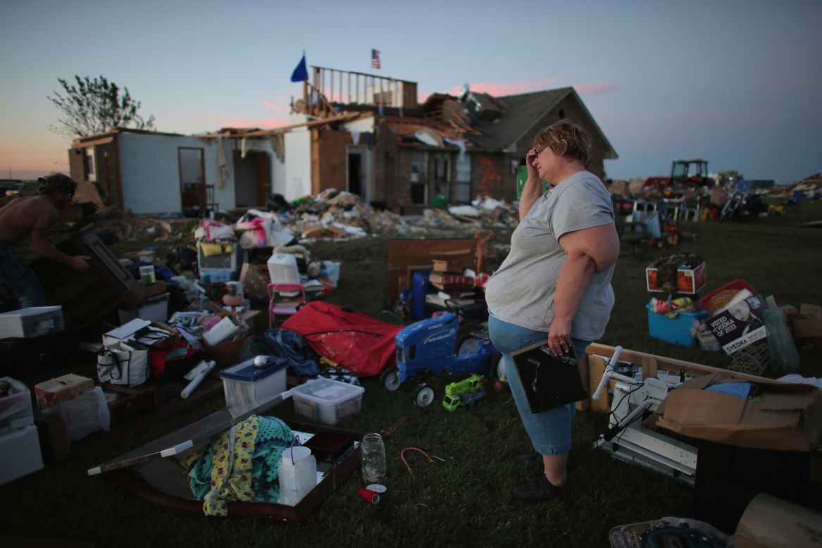 Yvonne Merritt stands among the things she was able to save from her home in El Reno on June 1.