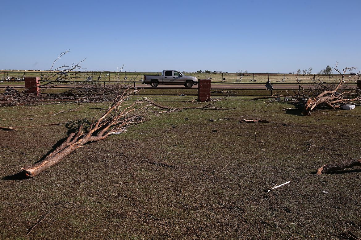 Downed trees sit in the parking lot of the Canadian Valley Technology Center in El Reno on June 1.