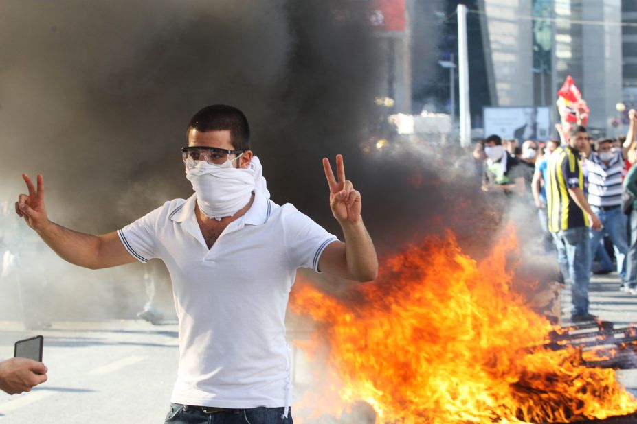 A protester flashes a victory sign as he takes part in a demonstration in Ankara on Saturday, June 1 in support of the protests in Istanbul against  government plans to demolish a park. 