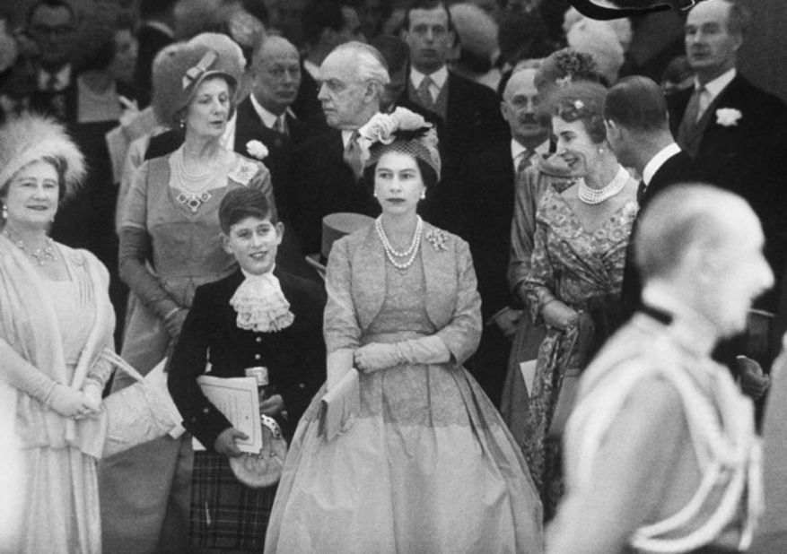 Queen Mother Elizabeth, from left, Prince Charles and Queen Elizabeth II attend Princess Margaret's wedding in 1960.