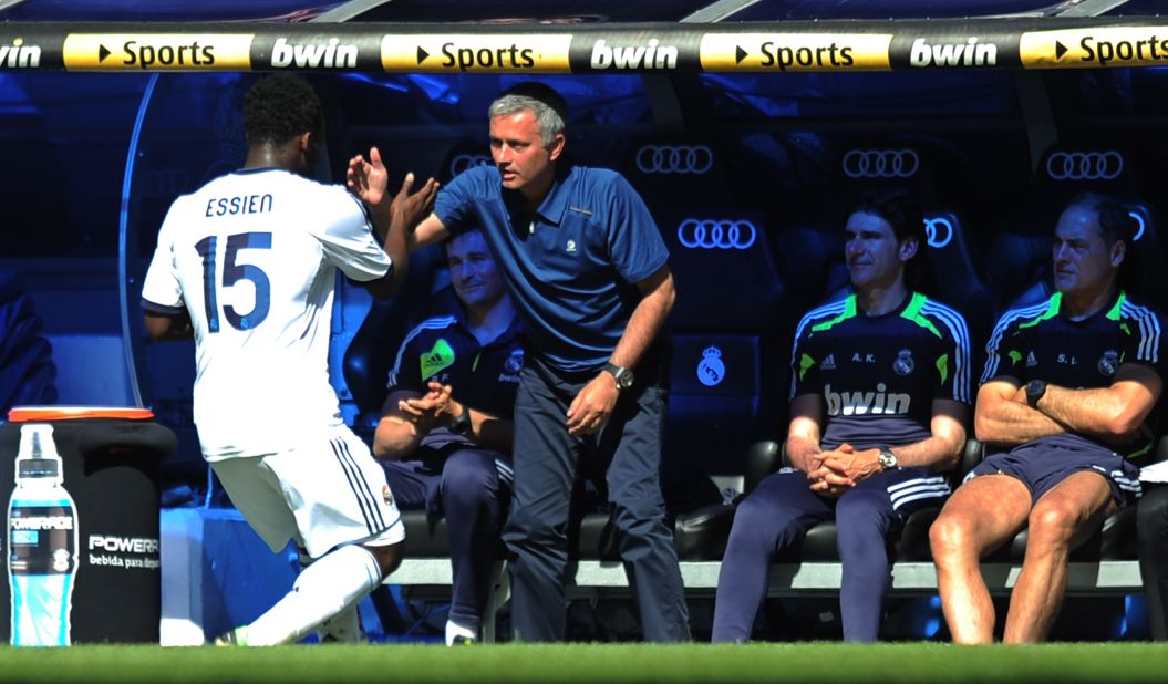 Mourinho celebrates with Michael Essien -- who he worked with at Chelsea and brought to Madrid this season -- after the midfielder put Real 2-0 up against Osasuna.  