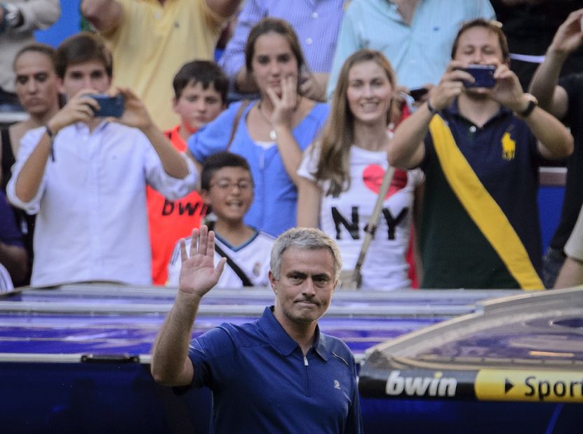 Jose Mourinho waves to the crowd following his final match in charge of Real Madrid -- a 4-2 home win against Osasuna. 