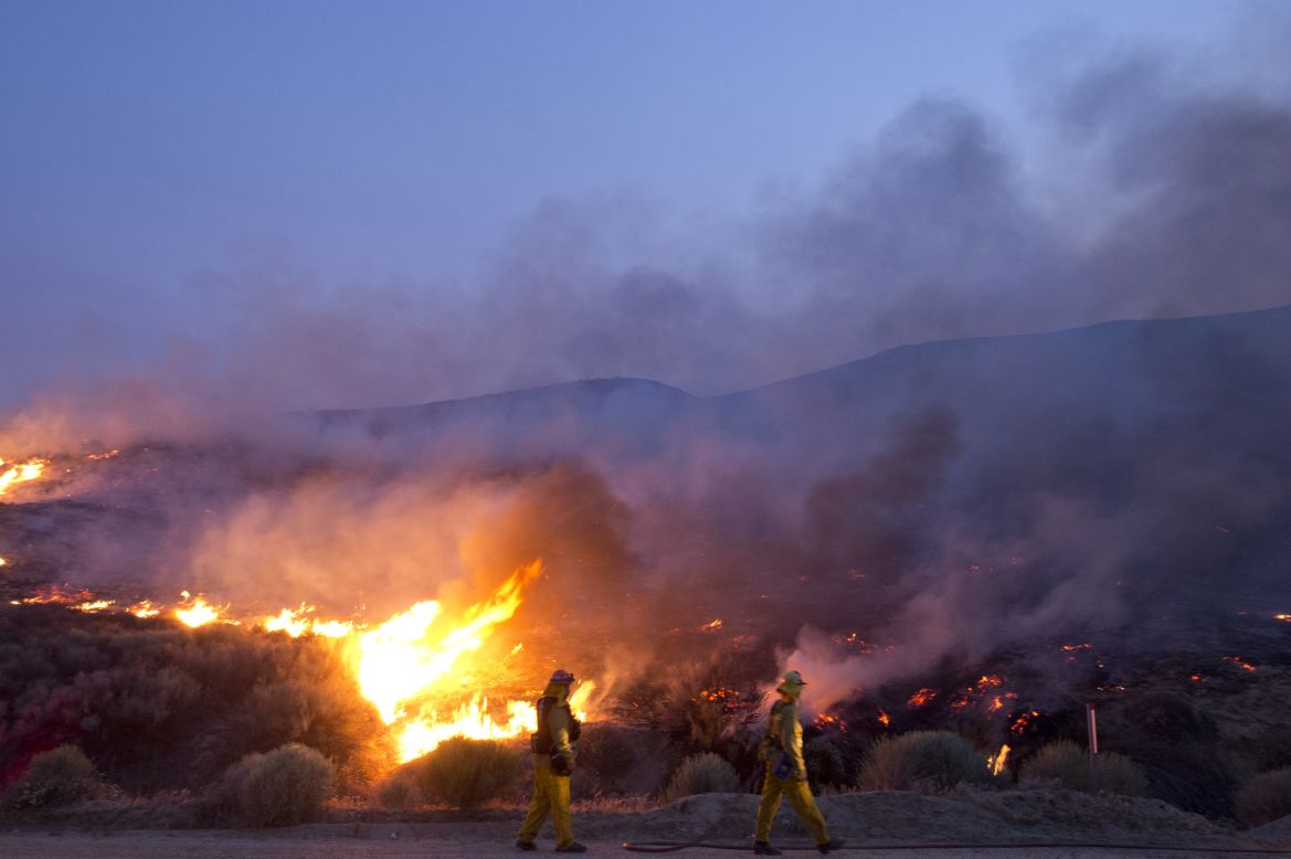 Firefighters battle the flames near Lake Hughes on June 2.
