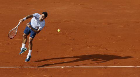 Switzerland's Roger Federer serves to Gilles Simon of France during a fourth-round match of the French Open on Sunday, June 2, in Paris. Federer defeated Simon 6-1, 4-6, 2-6, 6-2, 6-3.