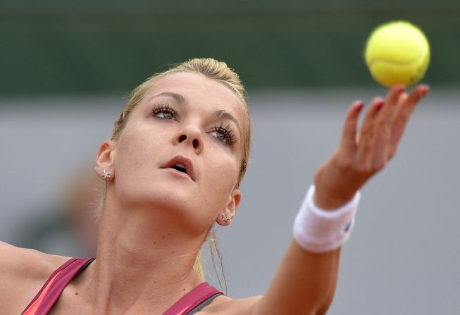 Poland's Agnieszka Radwanska serves to Serbia's Ana Ivanovic on June 2. Radwanska won 6-2, 6-4.