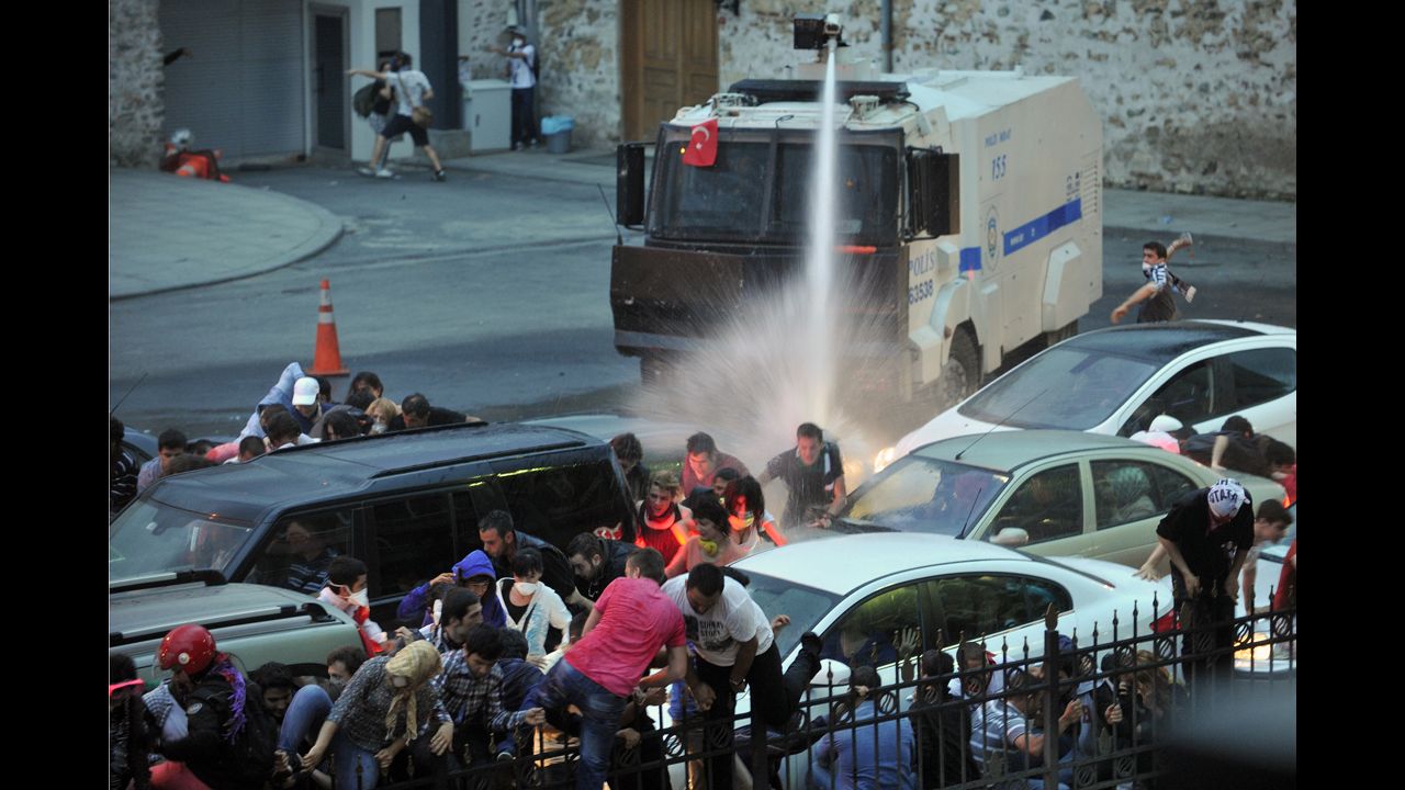 Police use a water cannon to disperse protesters outside Turkish Prime Minister Recep Tayyip Erdogan's working office in Istanbul on June 2.