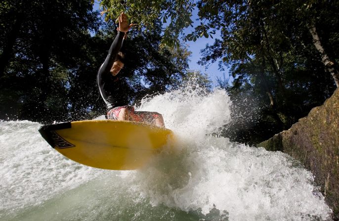 The Qiantang River is just one of a growing number of inner-city surfing spots around the world. Munich's Eisbach River (pictured) has been a popular surfing destination for more than four decades. 