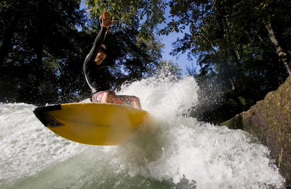 The Qiantang River is just one of a growing number of inner-city surfing spots around the world. Munich's Eisbach River (pictured) has been a popular surfing destination for more than four decades. 