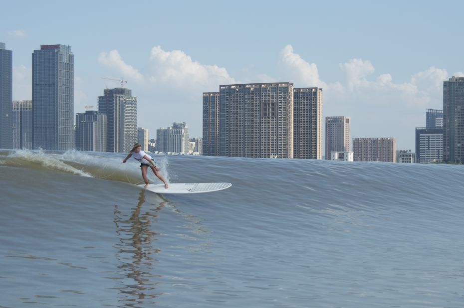 Each year, international surfers compete on Qiantang River, riding the "Silver Dragon" wave, which flows through the city of Hangzhou.