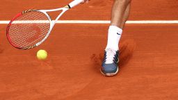 Roger Federer plays a forehand during during day one of the French Open at Roland Garros on May 26, 2013 in Paris, France.
