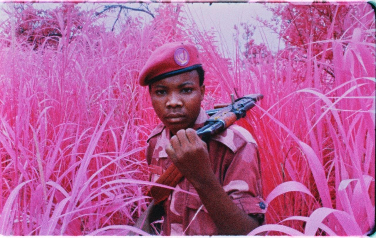 A young soldier from the Mai Mai Yakutumba militia group poses at a secret location near Lake Tanganyika, South Kivu, Eastern Congo, 2012.
