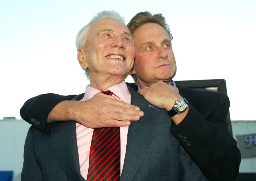 At the premiere of "It Runs In The Family," in  April 2003, Douglas and his father, actor Kirk Douglas, left, embrace at the Bruin Theater in Los Angeles.