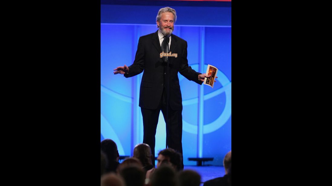 A bearded Douglas presents the award for Outstanding Film - Wide Release at the 2006 GLAAD Media Awards in New York City. In August 2010, he was diagnosed with throat cancer and began eight weeks of chemotherapy and radiation to treat a Stage 4 cancerous tumor.