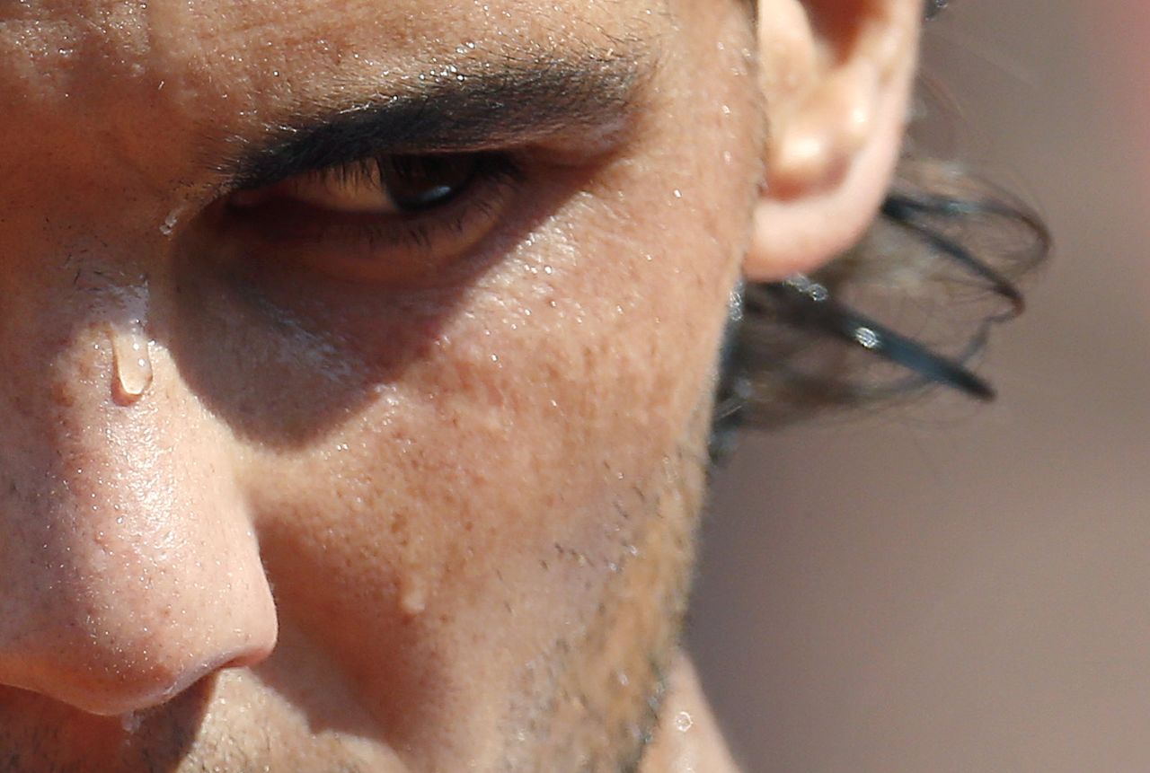 Sweat runs down the face of Spain's Rafael Nadal during his match against Japan's Kei Nishikori at the French Open on Monday, June 3, in Paris.