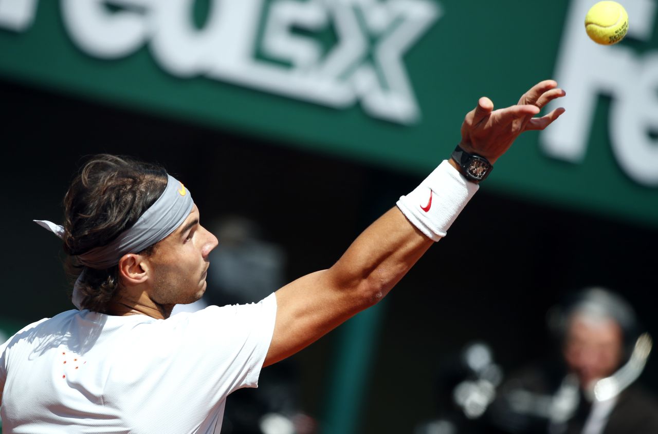 Nadal serves to Nishikori during their match on June 3.  Nadal defeated Nishikori 6-4, 6-1, 6-3.