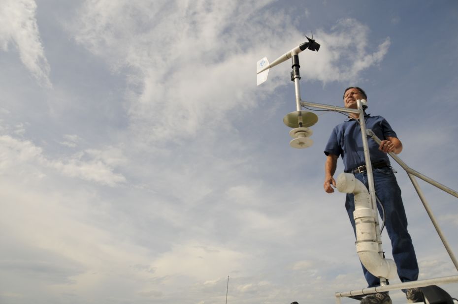 Tim Samaras, 54, stands with an anemometer, a device used to measure wind speed. The May 31 tornado had winds of at least 136 mph, according to a preliminary National Weather Service rating.