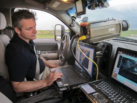 Carl Young, 45, reads data in a storm-chasing vehicle. He was a part of TWISTEX, the Tactical Weather Instrumented Sampling in Tornadoes Experiment, founded by Tim Samaras to help learn more about tornadoes and increase lead time for warnings.