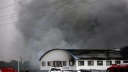 Smoke billows from a large poultry processing plant in Mishazi Township of Dehui City in northeast China's Jilin Province on Monday, June 3. More than 300 workers were inside the plant when the fire broke out about 6 a.m., the state-run Xinhua news agency said. More than 100 people were reported killed in the fire.