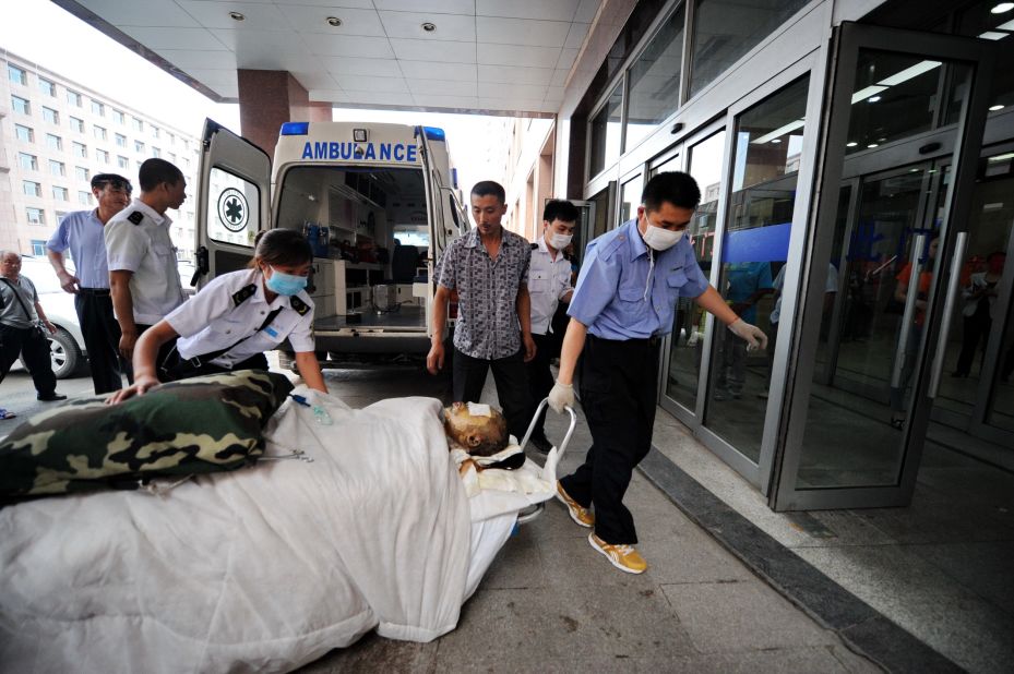 An injured worker is wheeled into a hospital in Changchun.