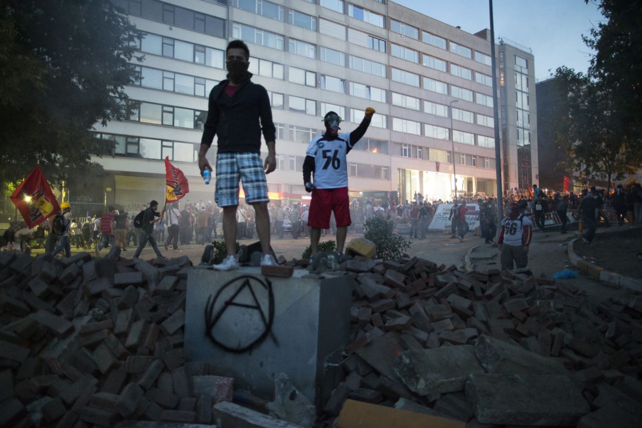 Protesters stand atop a pile of rubble during clashes with Turkish police on Monday, June 3. 