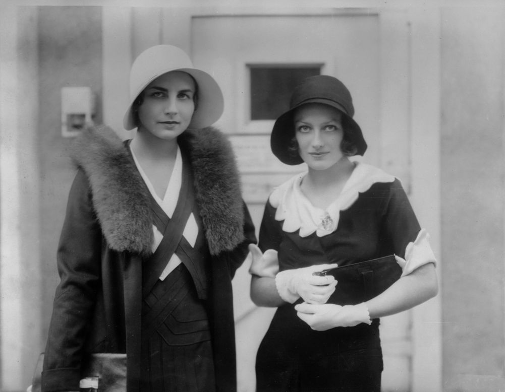 Lenglen's crown as the queen of women's tennis was taken by American Helen Wills Moody, pictured left  with Hollywood actress Joan Crawford.