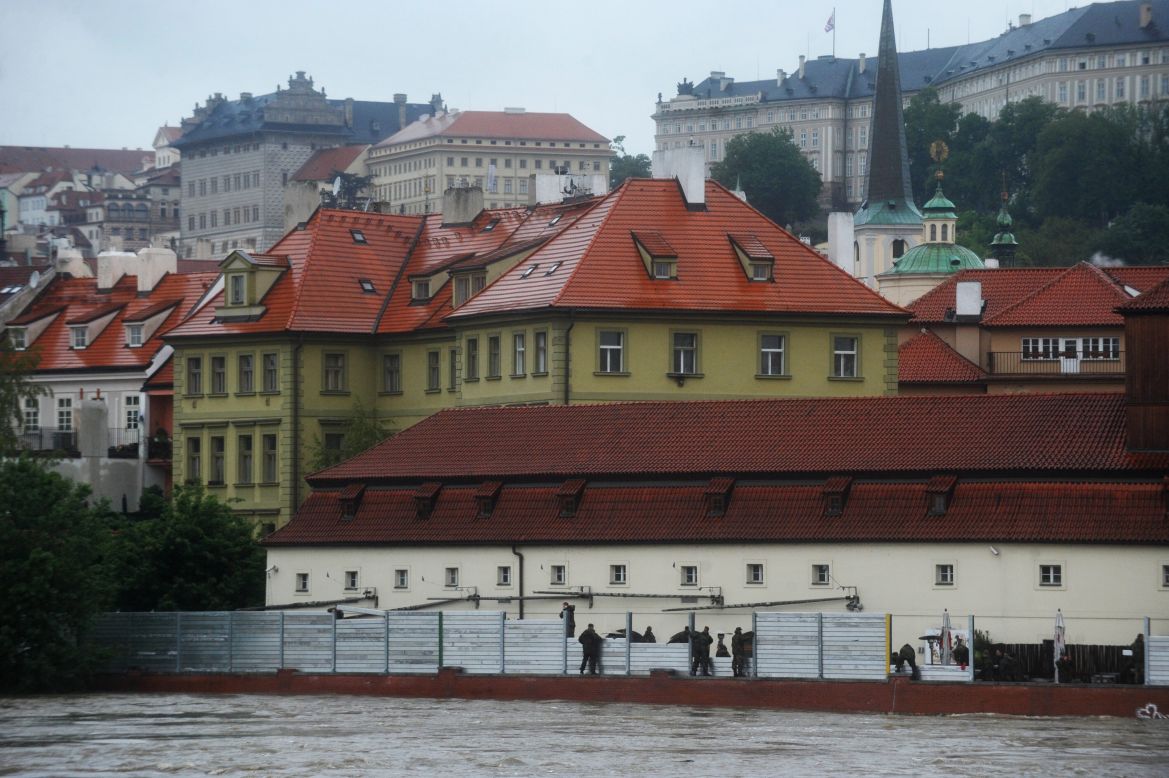 Czech army personnel build flood barriers on the bank of the flooded Vltava River in Prague. Transportation was severely disrupted in Prague, as well as other parts of Bohemia, according to a spokeswoman for the Czech Fire Department.
