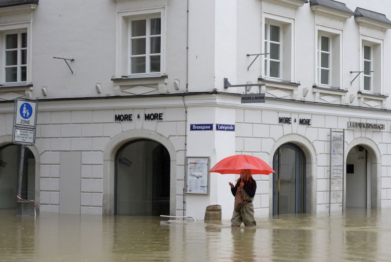 A woman wades through a flooded street in Passau, Germany, on June 3.