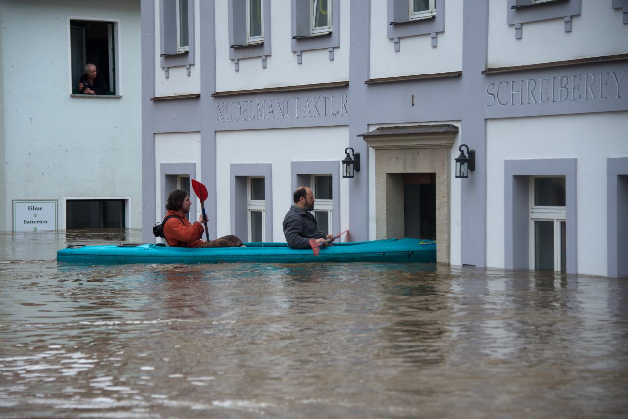 People canoe in the flooded city of Wehlen, Germany, on June 4.