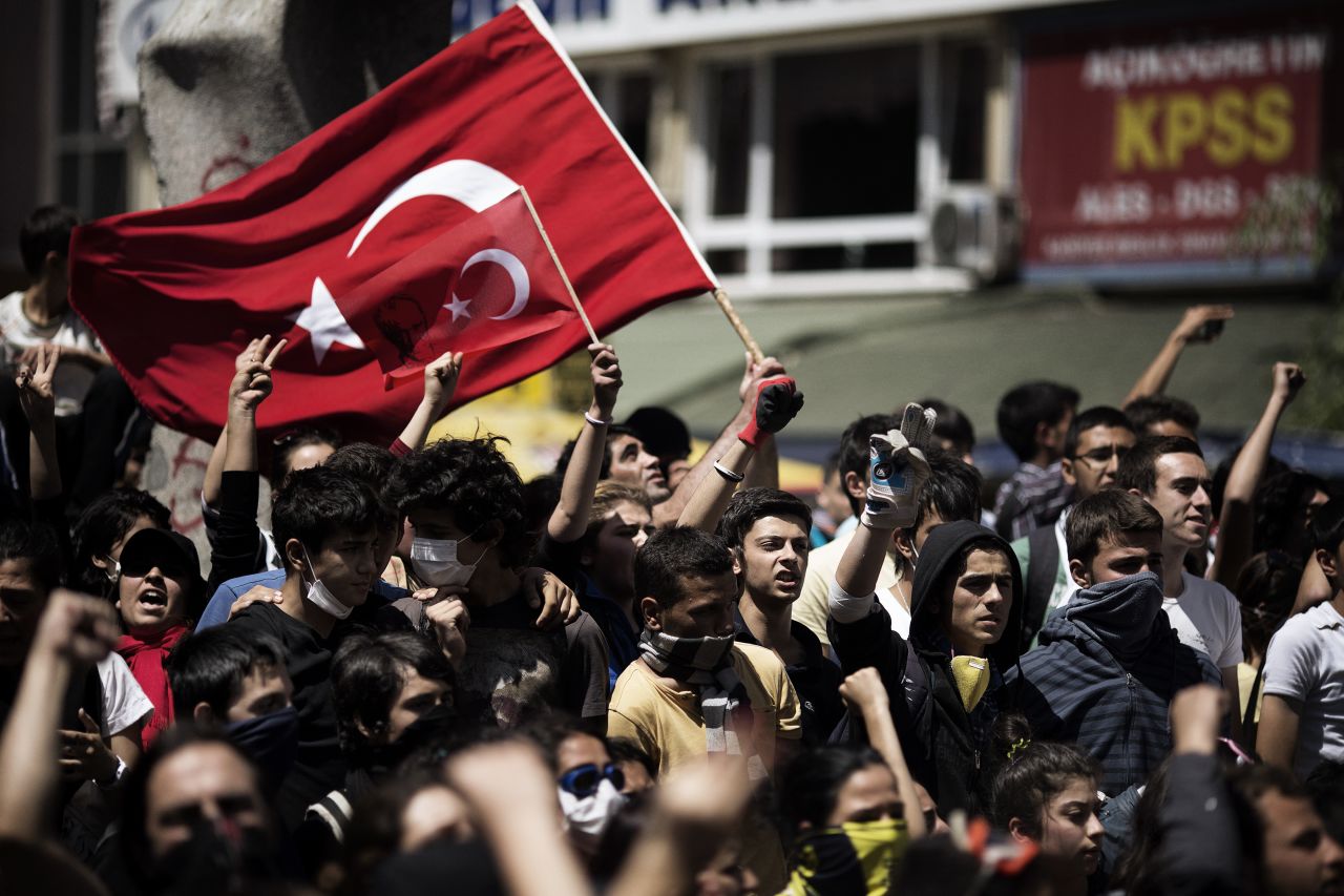 Demonstrators wave their national flag on June 4, during a protest in Ankara. 