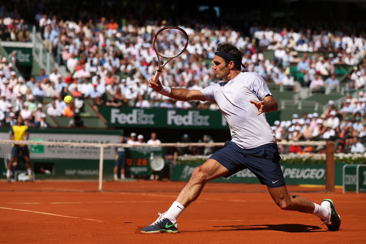 Federer plays a backhand to Tsonga during the match on June 4.