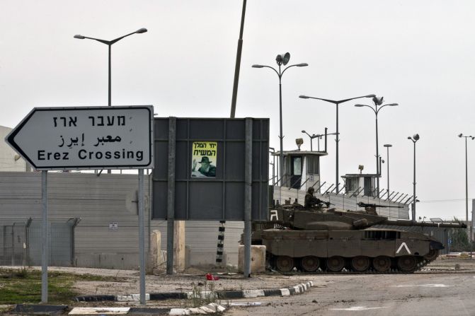 An Israeli army tank is seen along the Erez crossing passage along the southern Israeli border with the Palestinian Gaza Strip in November 2012. Sarsak was arrested at the crossing in 2009. <br />