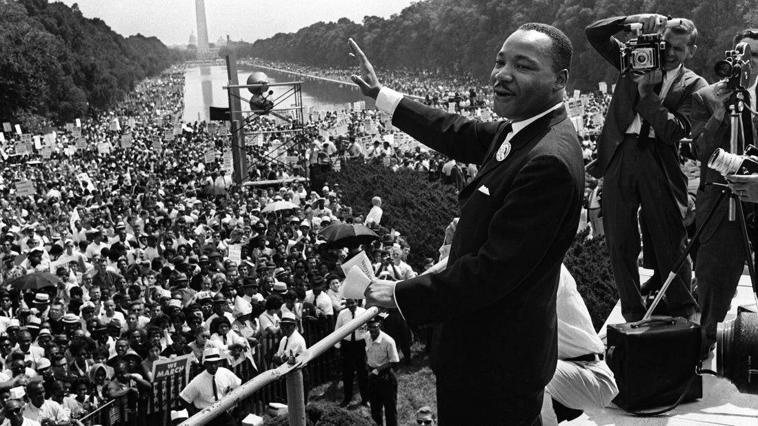The Rev. Martin Luther King Jr. waves to supporters on the Mall in Washington during the March on Washington on August 28, 1963.