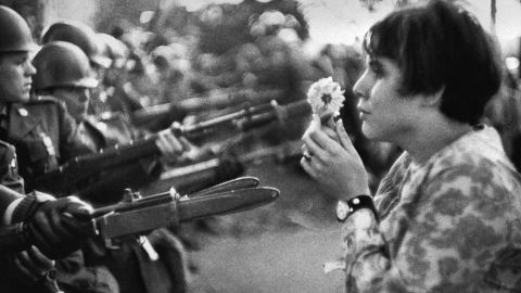 Jan Rose Kasmir stands in front of National Guard members outside the Pentagon during an anti-Vietnam War march on October 21, 1967.