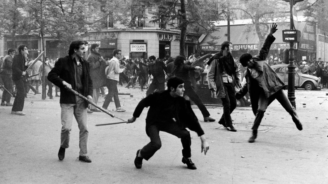 Students in Paris hurl projectiles at the police on Boulevard Saint-Germain during the uprisings of May 6, 1968.