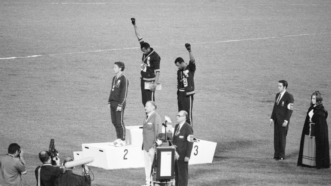 Tommie Smith and John Carlos, gold and bronze medalists in the 200-meter run at the 1968 Olympic Games, raise their fists in the Black Power salute on October 16, 1968, in Mexico City.